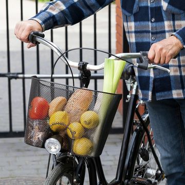 A filled bicycle basket. 